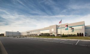 A large building with many flags on it