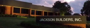 A building with the jackson bureau sign in front of it.