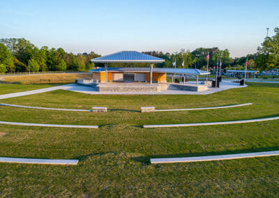 A park with benches and an amphitheater in the middle.