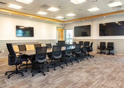 Modern conference room with a large table.