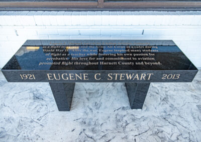 Black granite bench memorial for Eugene Stewart.