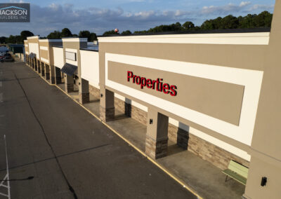 A commercial building with "Properties" sign.